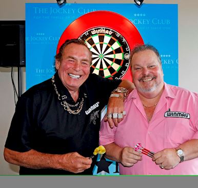 RACEGOERS HAVE THE CHANCE TOMORROW TO TEST THEIR DARTS SKILLS AGAINST STARS OF THE OCHE MANLEY AND G